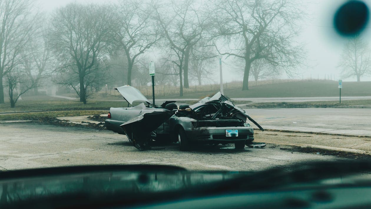 Damaged car after a collision on the roadside